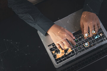 A business person in a modern office touches a virtual dashboard to analyze operational...