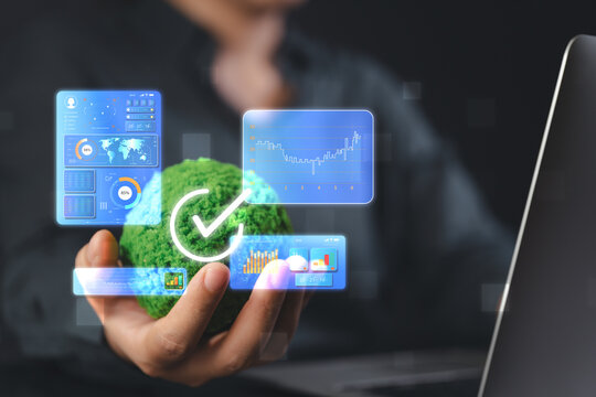 A business leader in a green office uses a virtual interface to analyze performance, choosing an efficient workflow that promotes environmental sustainability and corporate responsibility