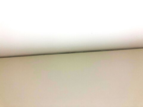 White ceiling with clean geometric lines, ceiling corner design, ideal for architecture themes or minimalist interior design concepts