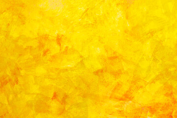 The texture of the wall with the chipped old antique plaster. Abstract background painted in Golden yellow