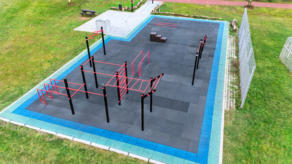 Outdoor gym for street workout aerial drone view, modern sports ground with bars and equipment for outdoor fitness and exercise, working out in calisthenics park outdoors, healthy lifestyle in city 
