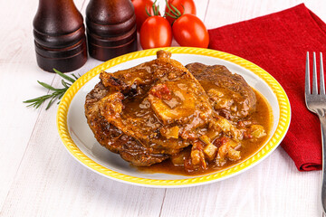 Italian cuisine - ossobuco with sauce