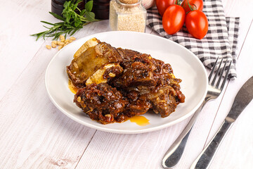 Prepared tasty beef ribs with sauce