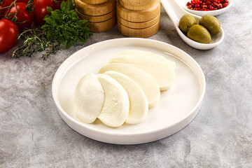 Organic mozzarella cheese slices in the plate
