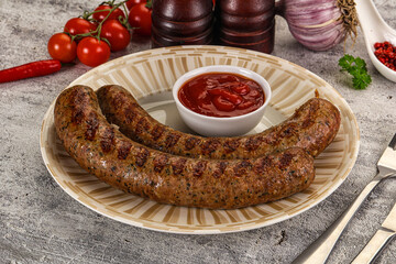 Grilled beef sausages with sauce