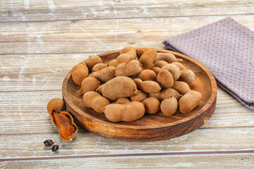 Tropical exotic Tamarind fruit heap