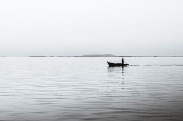 boat on the sea in black and white