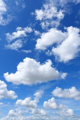 Fototapeta premium Expansive Blue Sky with Fluffy White Clouds A Stunning Nature Photography