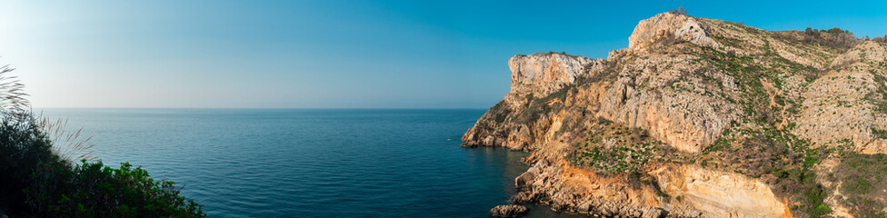 Panoramic view to the cliffs and the Mediterranean sea, in Benitachell, Comunidad Valenciana (Spain)