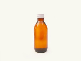 Amber glass bottle with an aluminum cap isolated on a white background, brown glass bottle for pharmaceuticals, syrups, essential oils, and cosmetics