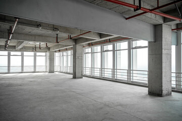 empty pure commercial office building undecorated in gray colors.open space office