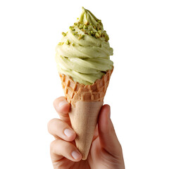 Hand holding a pistachio ice cream cone with chopped pistachios on top against a black background