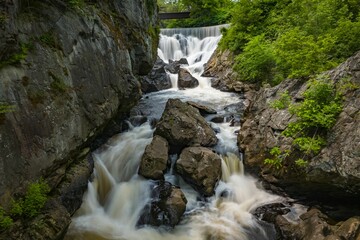 Waterfall in a Green Gorge