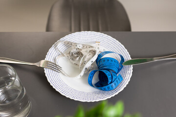 A creative juxtaposition of measuring tapes and cutlery on a plate, symbolizing precision and...