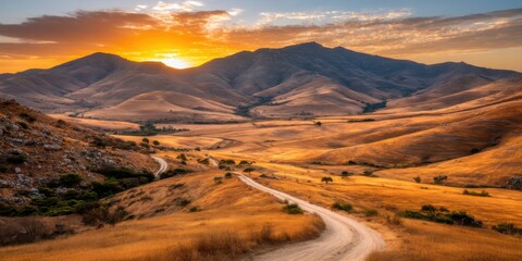 Fototapeta premium Breathtaking Aerial Panoramic Serene Golden Sunrise Landscape Concept. Majestic Sunset Over Rolling Hills and Winding Dirt Road in a Serene Landscape