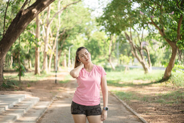 Asian women are stretching their muscles before going out to run to the park to keep themselves...
