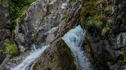Switzerland, Meiringen, a large waterfall over a rocky cliff
