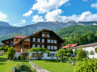 Switzerland, Meiringen, a building with a mountain in the background