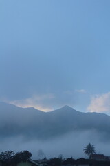 natural scenery, sky, clouds, fog, rice fields, trees and mountains.