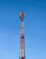 Cellular Communication Tower with Clear Blue Sky Background