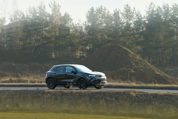 Elegant 4x4 vehicle traveling through nature © AlexGo