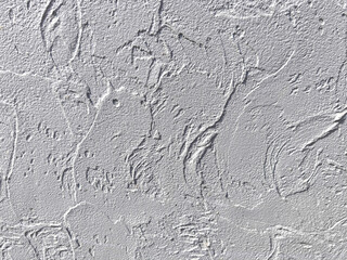 A wall with a textured surface. The texture is rough and uneven, giving the wall a rugged appearance
