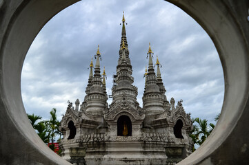 Fototapeta premium Pagoda in evening, Lanna Architecture, Symbols of Buddhism, South East Asia at Phra That Wisutthiyan Temple (Trailaksanaram Forest Temple) Doi saket, Chiang Mai, Northern Thailand