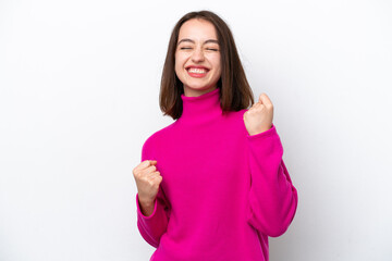 Fototapeta premium Young Ukrainian woman isolated on white background celebrating a victory
