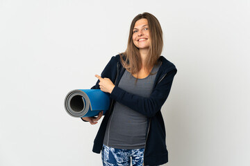 Obraz premium Slovak girl going to yoga classes isolated on white background pointing back