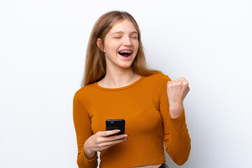 Teenager Russian girl isolated on white background with phone in victory position