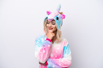Young Russian woman with unicorn pajamas isolated on white background looking to the side