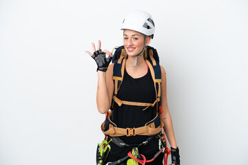 Young caucasian rock climber woman isolated on white background showing ok sign with fingers