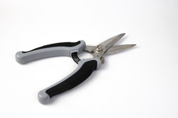 Steel garden shears or Scissors, shears tool with black and gray handles for pruning plants and flowers, garden work, isolated on white background. Close-up.