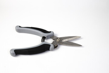 Steel garden shears or Scissors, shears tool with black and gray handles for pruning plants and flowers, garden work, isolated on white background. Close-up.