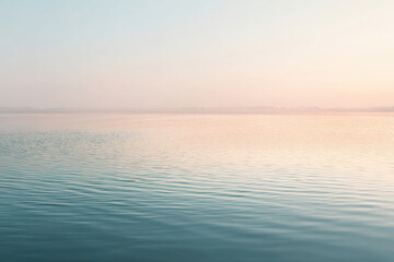 Obraz premium abstract scene of smooth water surface reflecting soft hues of evening light creating serene atmosphere