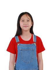 Portrait of smiling Asian girl child in blue jean dungarees isolated on white studio background.