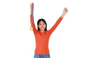 Cheerful Asian girl kid show gold medal on white studio background. Child celebrating victory posture concept.