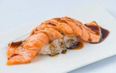 Grilled Salmon Nigiri Sushi with Sweet Soy Sauce Drizzle.
