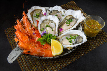 Fresh Oysters and Shrimp Platter with Seafood Sauce and Lemon