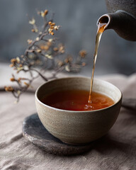 Pouring tea  in brown colors