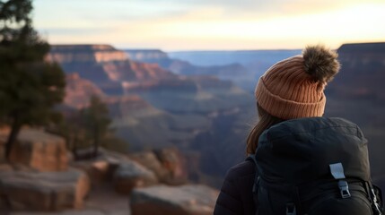 Woman in Beanie Hiking Grand Canyon at Sunset
