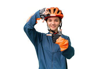 Teenager cyclist girl over isolated chroma key background focusing face. Framing symbol