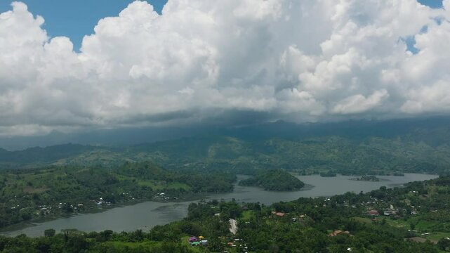 Lake Sebu and farmland under blue sky and clouds. Mindanao, Philippines.