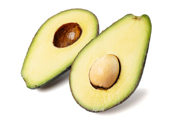 Healthy food and ingredients - Half of ripe organic green avocado fruit with pit isolated on white background with built-in clipping path