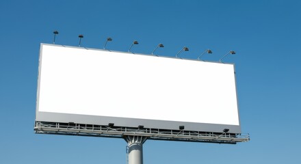 Obraz premium Empty billboard ready for advertising against a clear blue sky