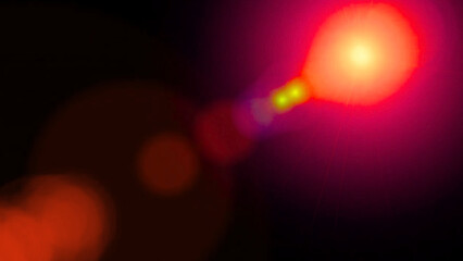 Red and orange lens flare light bokeh effect glow dark background abstract photography digital art image vibrant colors radiant energy