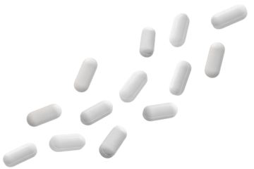 Falling white medicine pills capsule isolated on white background