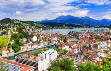 Lucerne, Switzerland. Historic city center with its famous Chapel Bridge and Mt. Pilatus on the background. (Vierwaldstattersee)