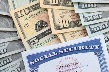 American US dollars money bills and US social security number card close up