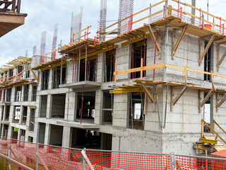 Modern concrete framework of new apartment building. Urban development in progress.